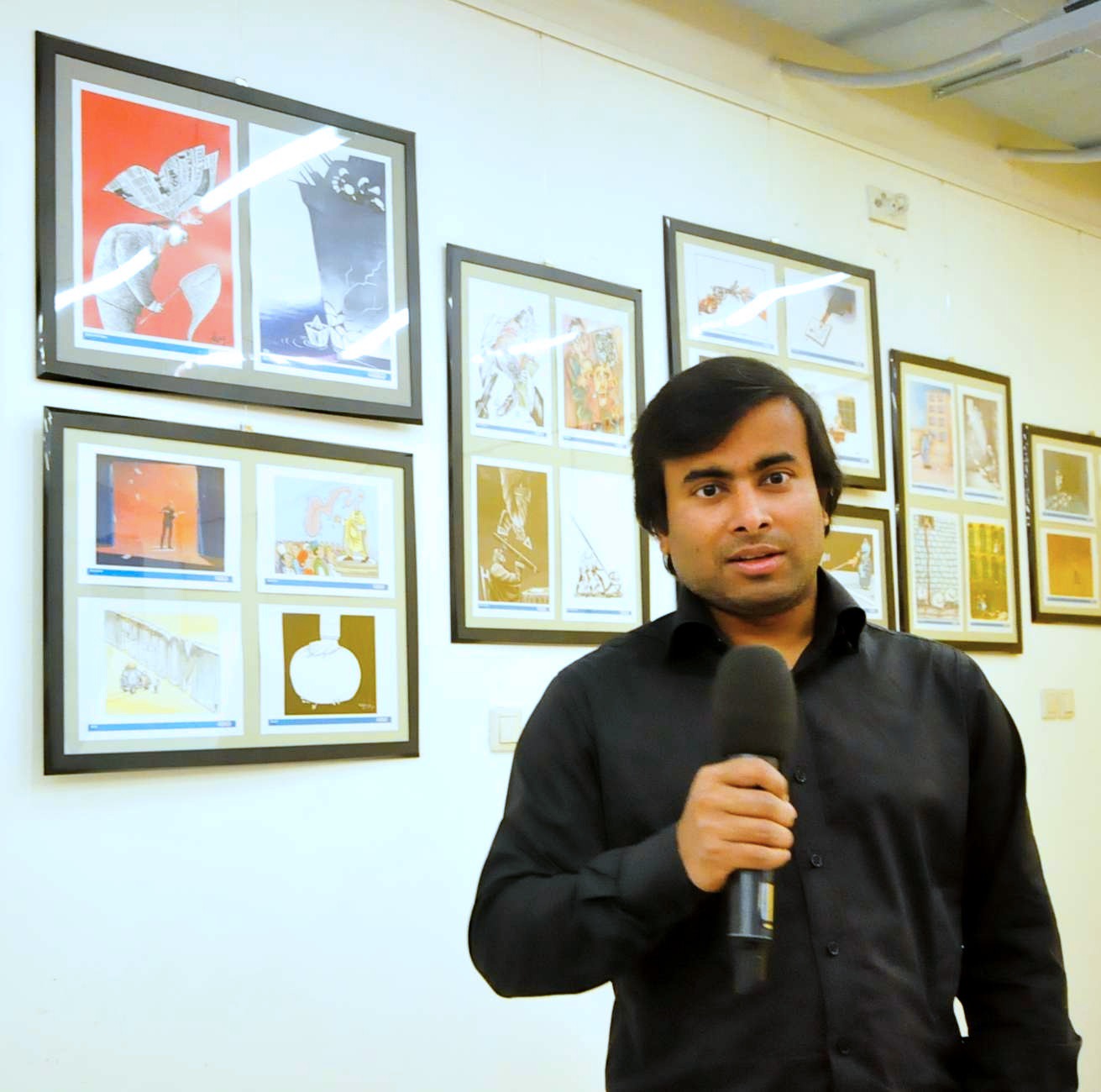 ARiF speaking at the opening of a Women's Rights cartoon exhibition